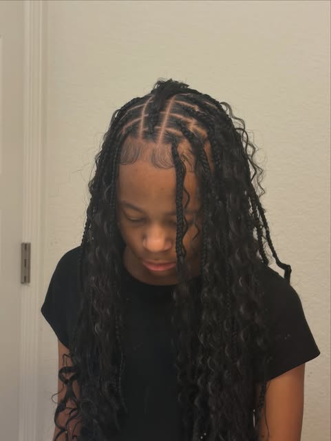 Long dark twists styled by Aleia